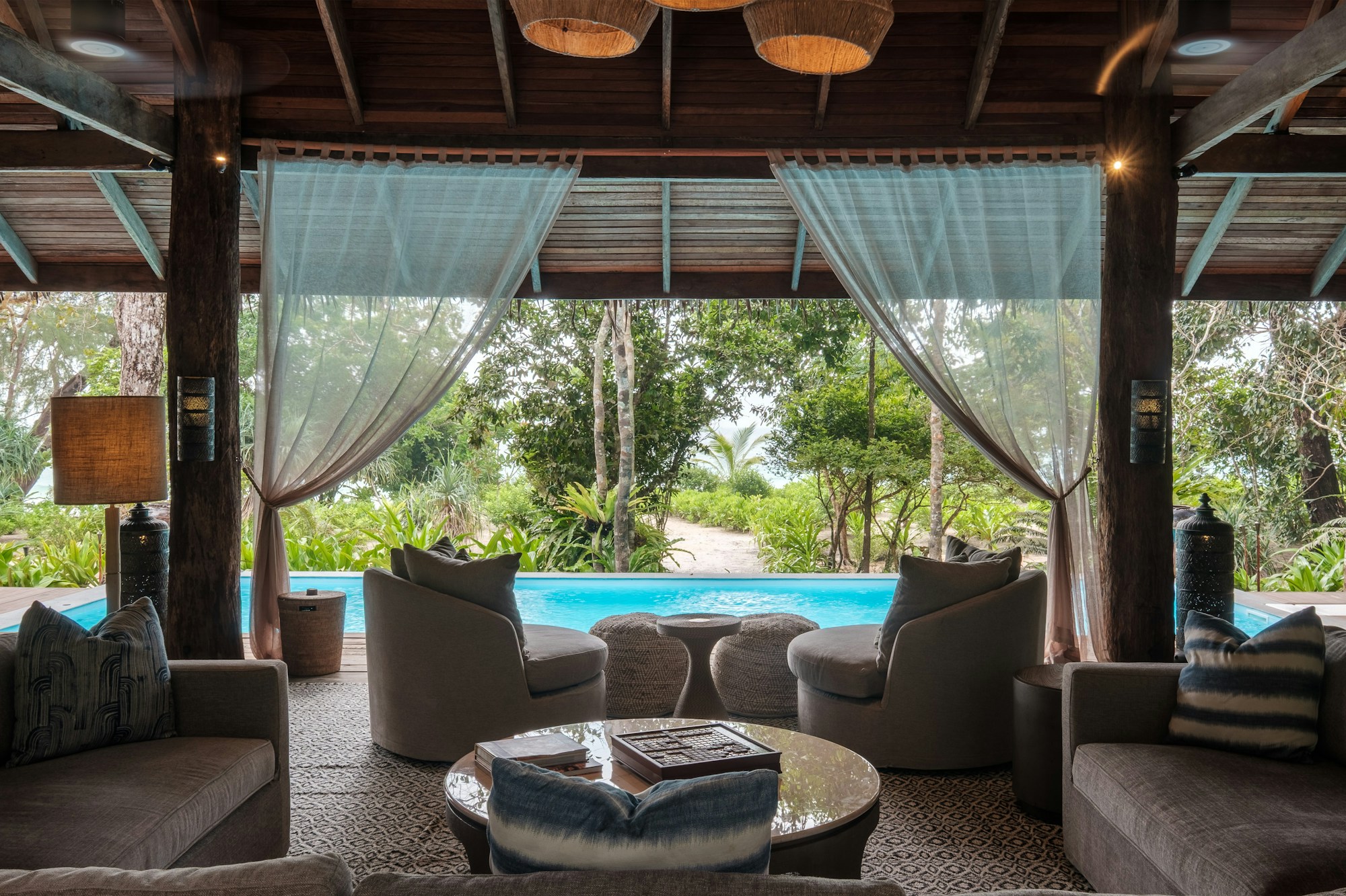 The Beach House living room with pool