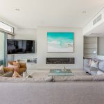 4 Bedroom Premium Beach House - lounge with fireplace