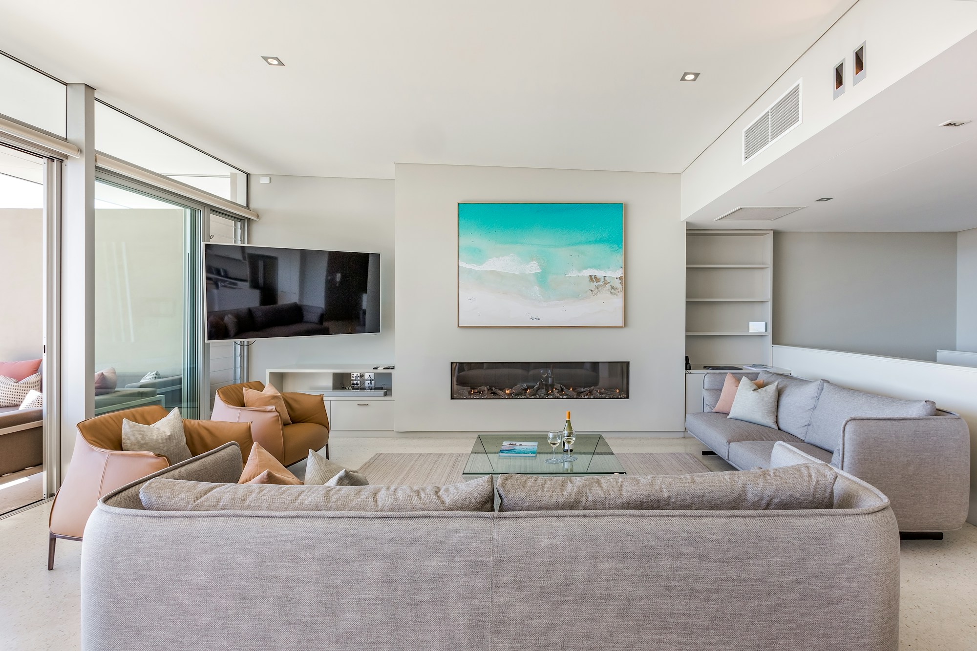 4 Bedroom Premium Beach House - lounge with fireplace